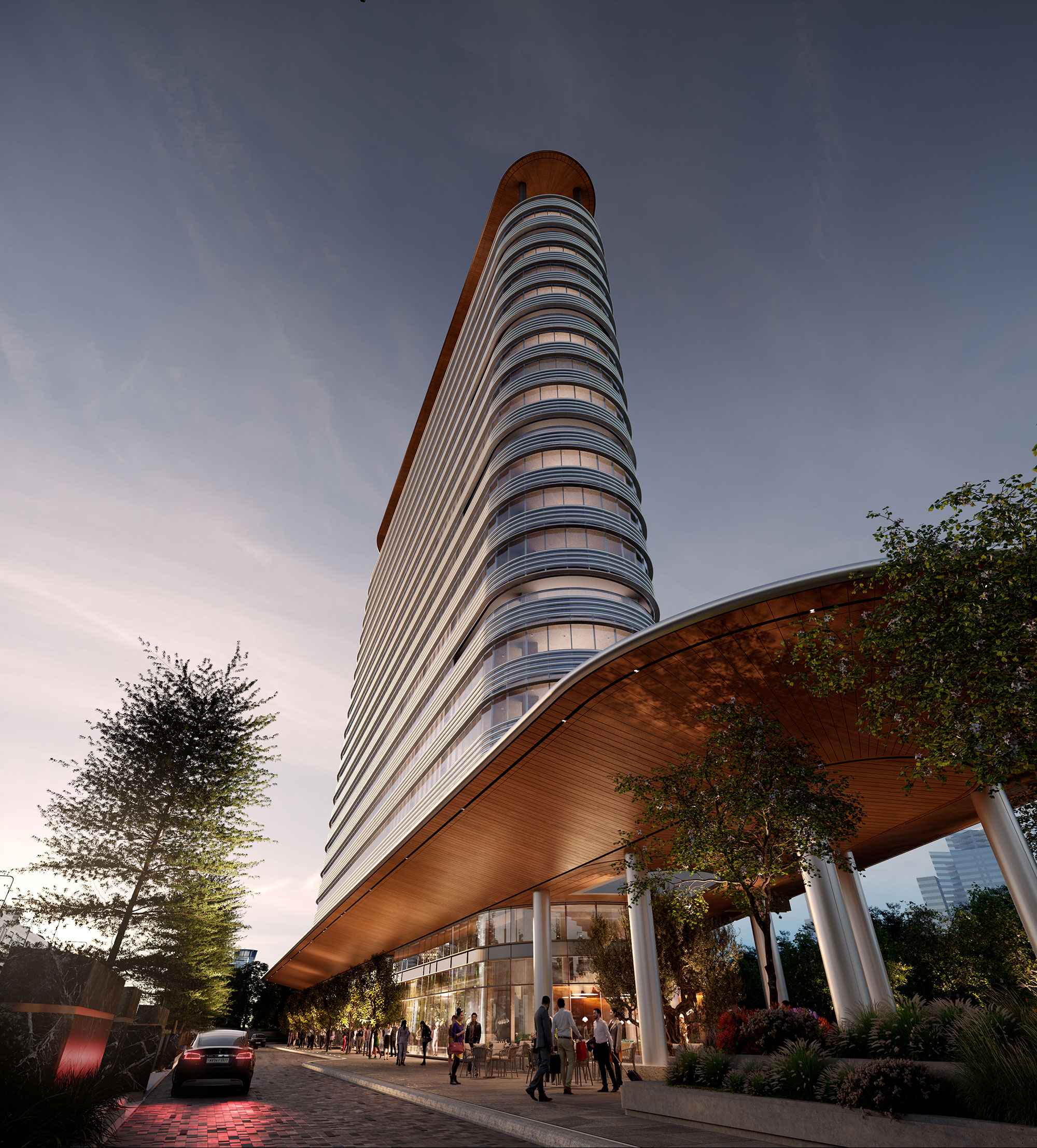 Evening view of the entrance canopy and tower facade