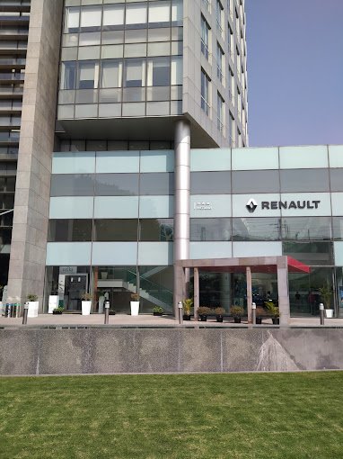 Ground-floor retail frontage (Renault showroom) facing MG Road