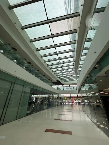Covered atrium / skylight walkway inside the complex